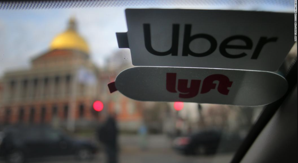 A sign offers directions to an Uber and Lyft ride pickup location at Logan International Airport.STEVEN SENNE/ASSOCIATED PRESS